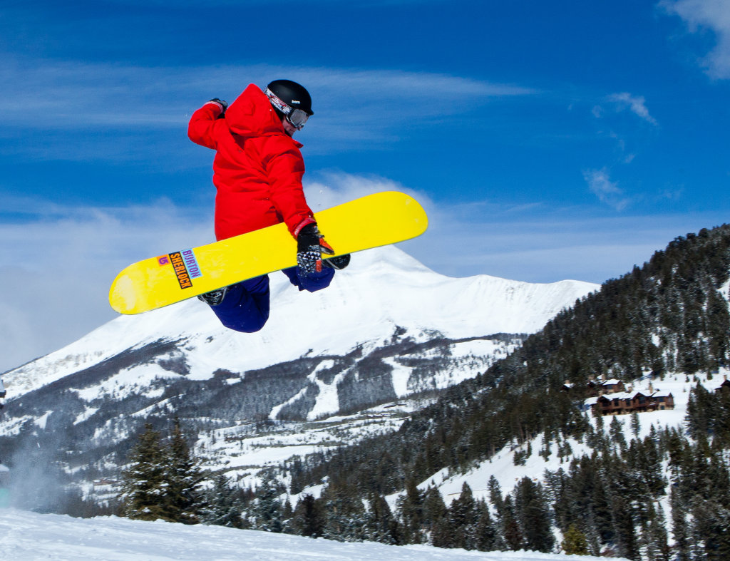 Snowboarder in mid jump